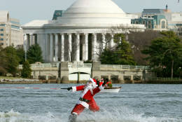 ARLINGTON, VA - DECEMBER 24:  Dressed as Santa Claus, Kerry Nistel water-skis on the waters of the Potomac River December 24, 2007 in Arlington, Virginia. This is the 22nd year Nistel has dressed as Santa and water-skied on Christmas Eve.  (Photo by Mark Wilson/Getty Images)