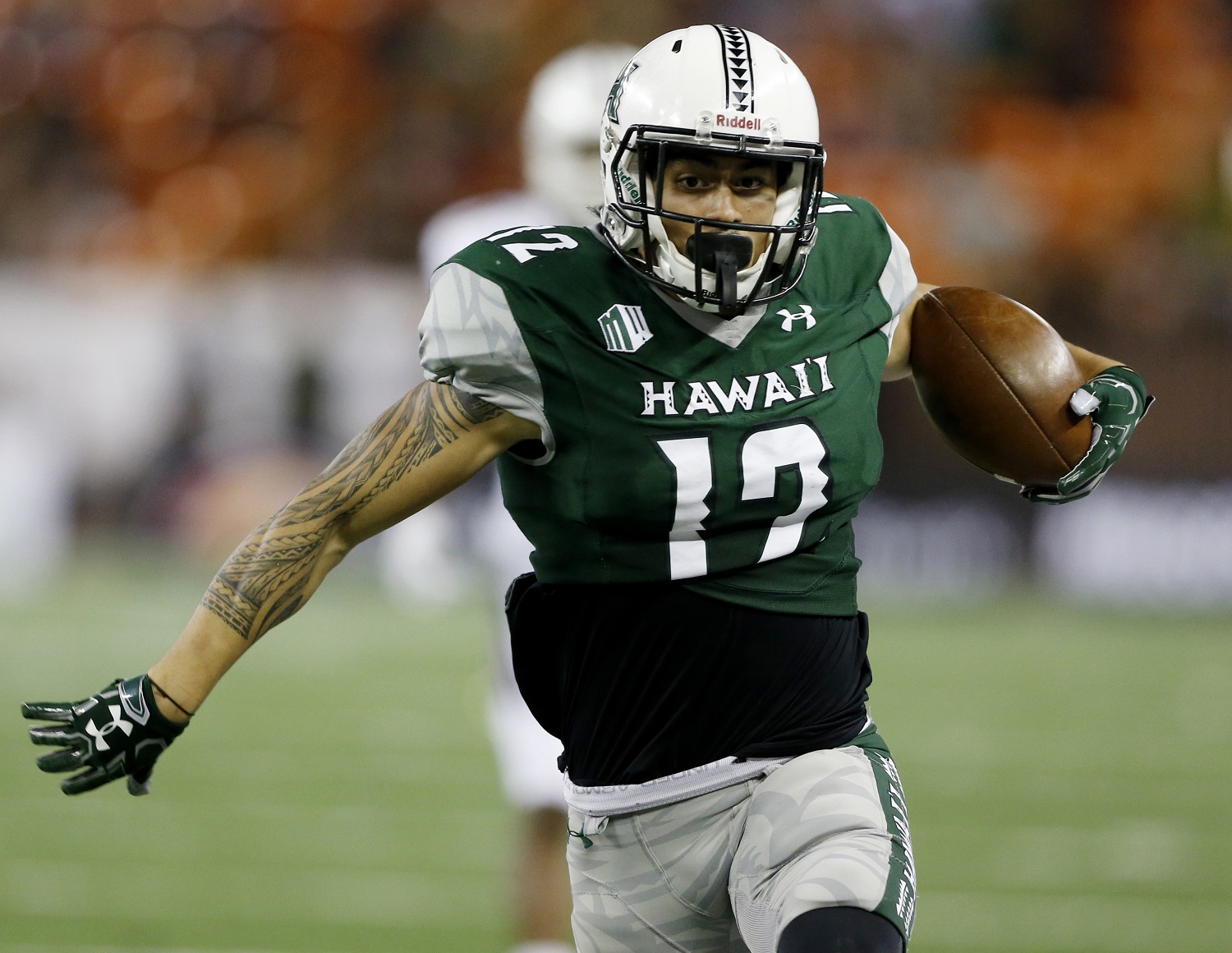 Hawaii wide receiver Keelan Ewaliko (12) makes the winning touchdown over Massachusetts during the forth quarter at the NCAA college football game on Saturday, Nov. 26, 2016, in Honolulu. Hawaii defeated Massachusetts 46-40. (AP Photo/Marco Garcia)