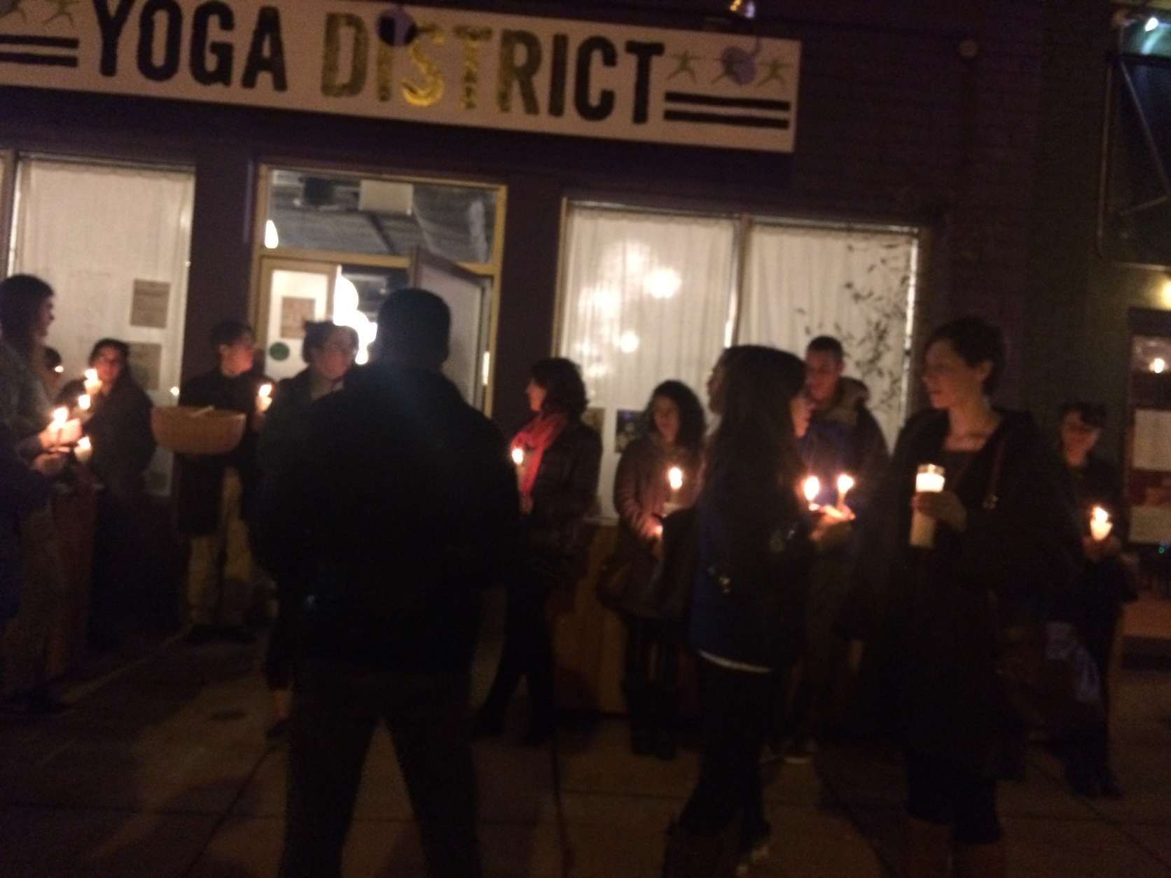 Mourners grieved at yoga district studio where Tricia McCauley led classes. McCauley went missing on Christmas Day and her body was found Tuesday. (WTOP/Dick Uliano)