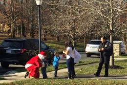 Santa Claus visits two little boys who were brutally stabbed last month. (WTOP/John Domen)