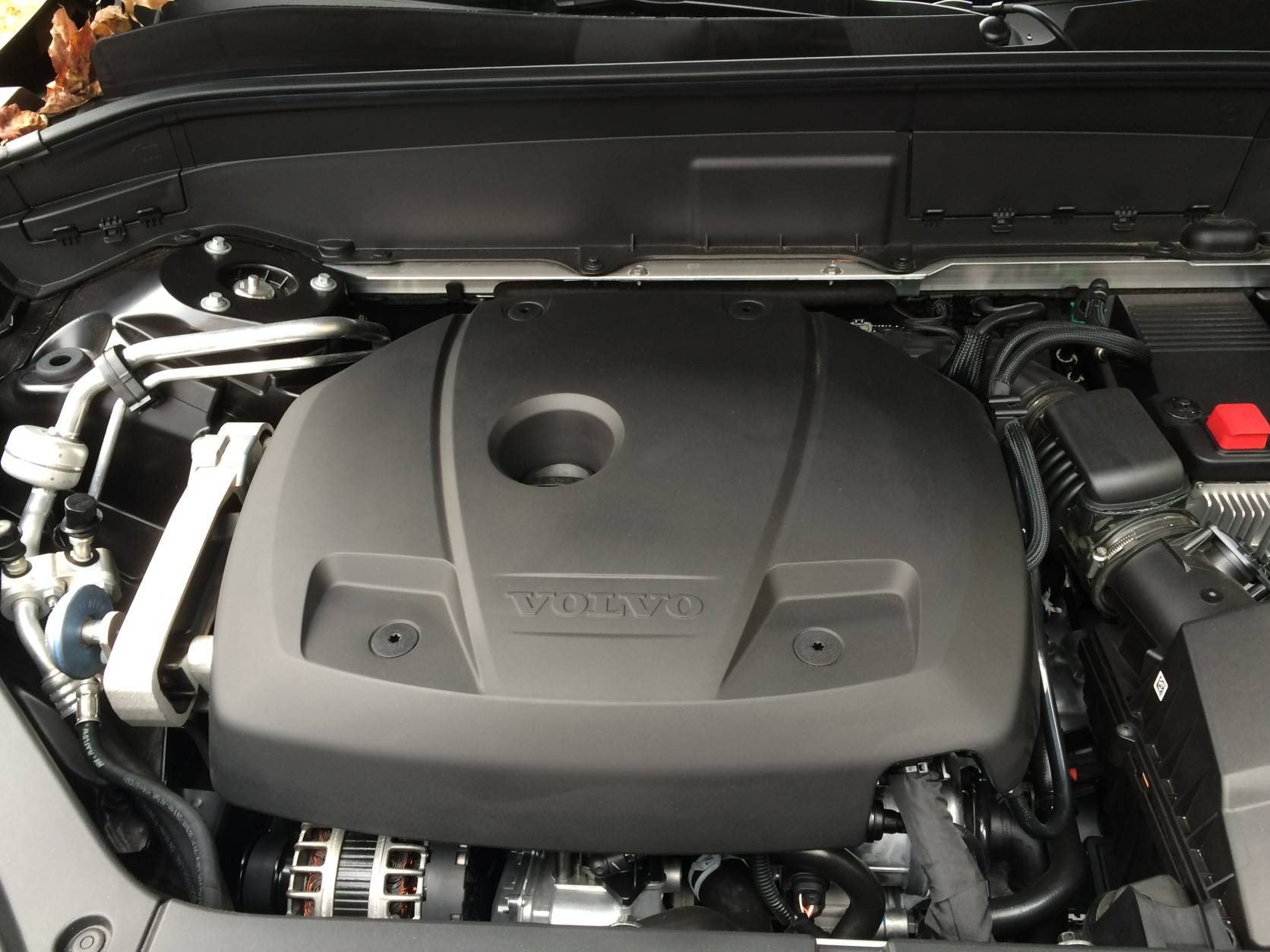 Most the midsize luxury SUV market use V6 engines. Not the Volvo XC-90. It has four cylinders with a twist: a supercharger and a turbo charger that makes 316 horsepower out of this small engine. (WTOP/Mike Parris)