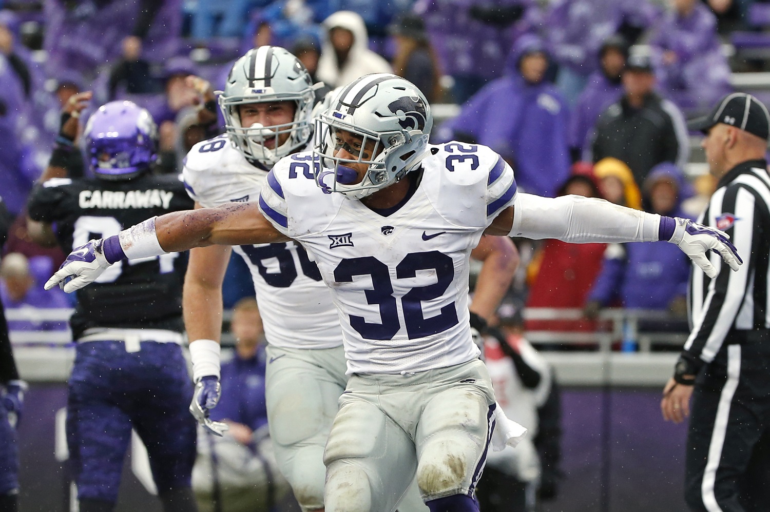 Kansas State running back Justin Silmon (32) and teammate Dayton Valentine (88) celebrate after Silmon ran for a touchdown against TCU during the second half of an NCAA college football game Saturday, Dec. 3, 2016, in Fort Worth, Texas. Kansas State won 30-6. (AP Photo/Ron Jenkins)