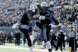 Memphis linebacker DeMarco Montgomery, left, and tail back Doroland Dorceus (28) celebrate a touchdown in the first half of an NCAA college football game Friday, Nov. 25, 2016, in Memphis, Tenn. (AP Photo/Nikki Boertman)