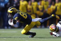 Michigan Wolverines wide receiver Jehu Chesson (86) dives for yardage against the Maryland Terrapins in the first half of an NCAA college football game in Ann Arbor, Mich., Saturday, Nov. 5, 2016. (AP Photo/Paul Sancya)