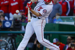 Washington Nationals' Daniel Murphy hits an RBI single against the Los Angeles Dodgers during the seventh inning in Game 2 of baseball's National League Division Series at Nationals Park, Sunday, Oct. 9, 2016, in Washington. (AP Photo/Pablo Martinez Monsivais)
