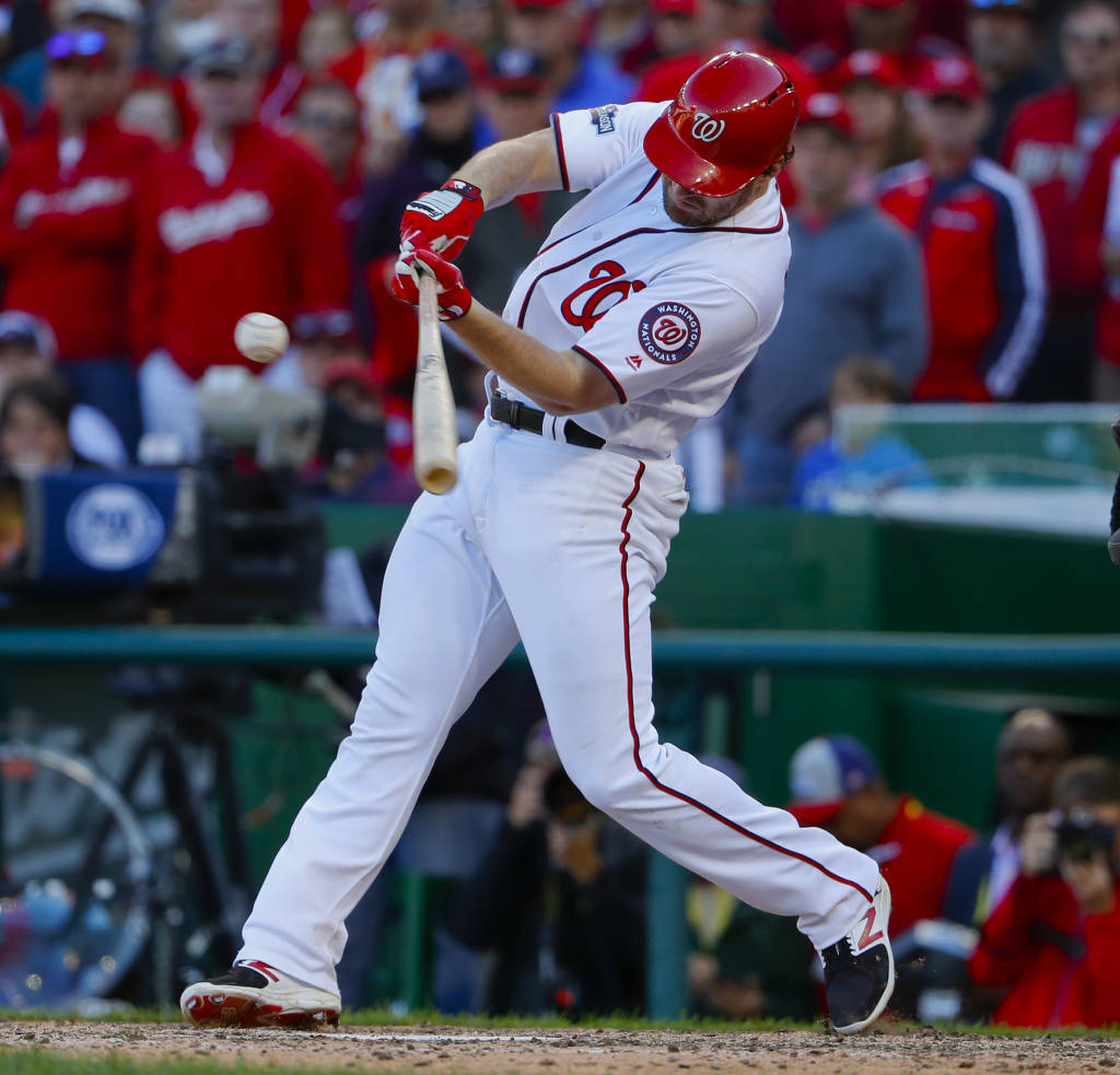 Washington Nationals' Daniel Murphy hits an RBI single against the Los Angeles Dodgers during the seventh inning in Game 2 of baseball's National League Division Series at Nationals Park, Sunday, Oct. 9, 2016, in Washington. (AP Photo/Pablo Martinez Monsivais)