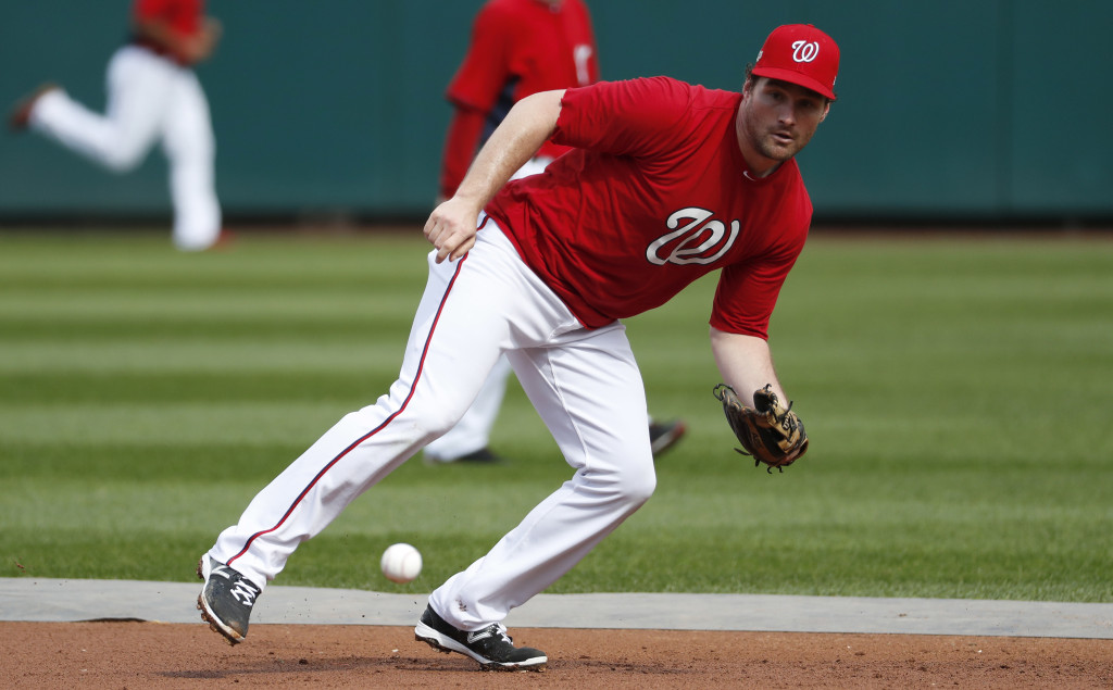 Washington Nationals second baseman Daniel Murphy goes after a ground ball during baseball batting practice at Nationals Park, Wednesday, Oct. 5, 2016, in Washington. The Nationals host the Los Angeles Dodgers in Game 1 of the National League Division Series on Friday. (AP Photo/Alex Brandon)