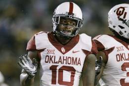 Oklahoma safety Steven Parker (10)during the first half/ second half of an NCAA college football game, Saturday, Nov. 19, 2016, in Morgantown, W.Va. (AP Photo/Raymond Thompson)