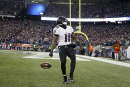 Baltimore Ravens wide receiver Kamar Aiken (11) celebrates his touchdown catch in the first half of an NFL divisional playoff football game against the New England Patriots Saturday, Jan. 10, 2015, in Foxborough, Mass. (AP Photo/Elise Amendola)