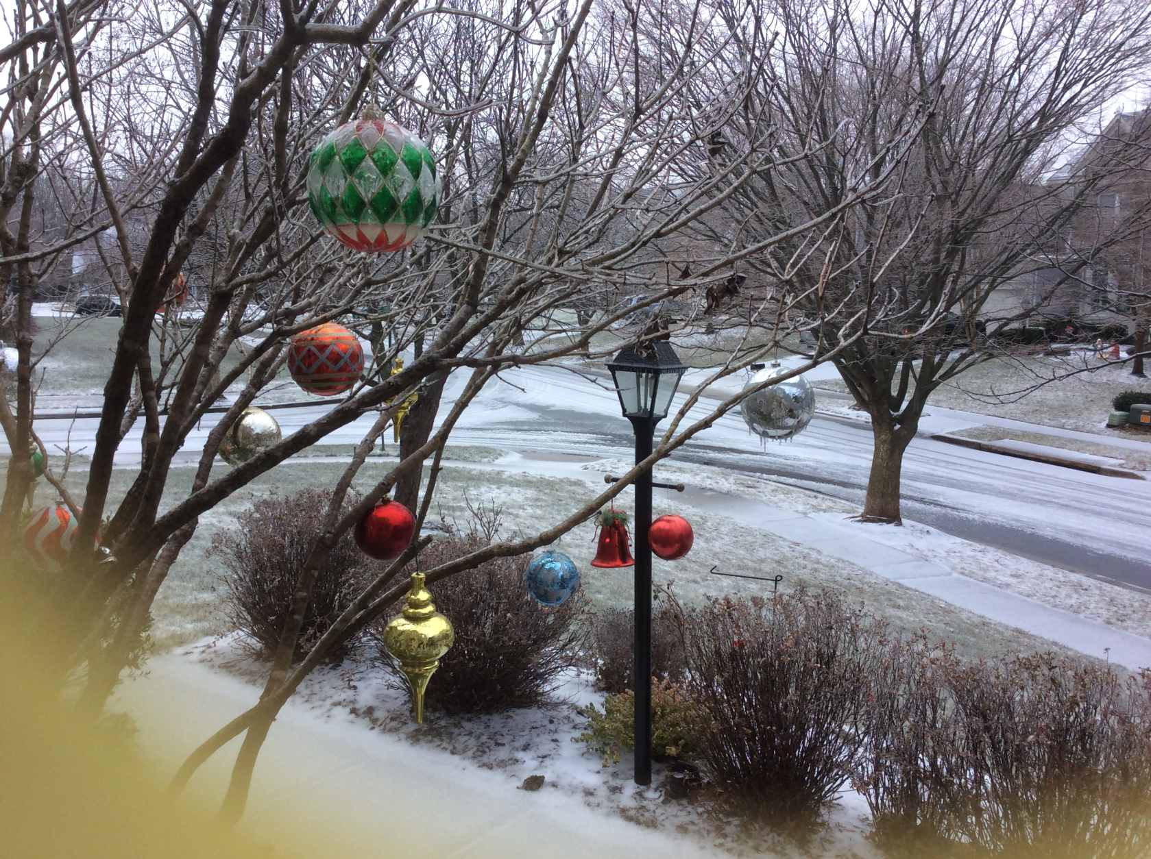 Ornaments hang from an icy tree in a frost-covered front yard Saturday morning in Olney, Md. (Courtesy Susan Temor)