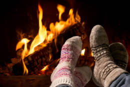Couple relaxing at the fireplace on winter eveningRelaxing at the fireplace on winter evening