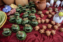 Various small figures of baked clay exposed for sale.