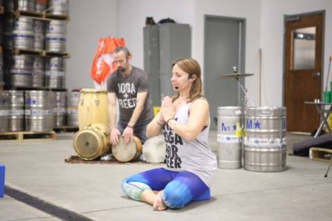 Bend and booze to the beat: Combining yoga, beer and live drumming