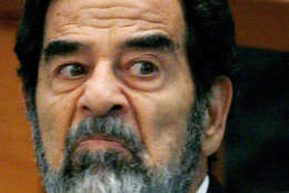 FILE - In this Aug. 23, 2006 file photo, former Iraqi leader Saddam Hussein looks across the court during day 3 of the Anfal Campaign trial in Baghdad, Iraq. Former Liberian President Charles Taylor is part of a long parade of leaders guilty or accused of similar, and in some cases far more appalling, crimes in modern history. Here is what happened to some: Saddam Hussein: the former Iraqi dictator was hanged at age 69 after an Iraqi trial. His brutality kept him in power through war with Iran, defeat in Kuwait, rebellions by northern Kurds and southern Shiite Muslims and international sanctions. A U.S.-led invasion drove him from power in 2003. (AP Photo/Daniel Berehulak, Pool, File)
