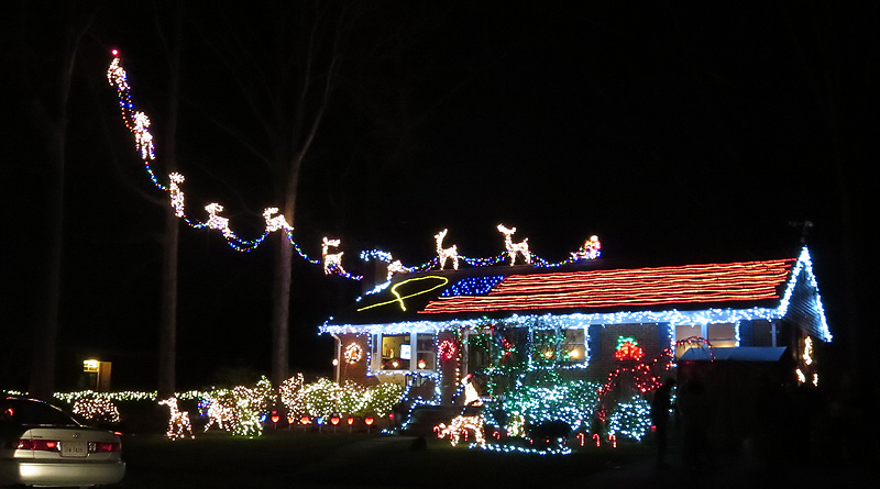Santa's reindeer take flight from a roof lit up as an American flag. (Courtesy Holly Zell)