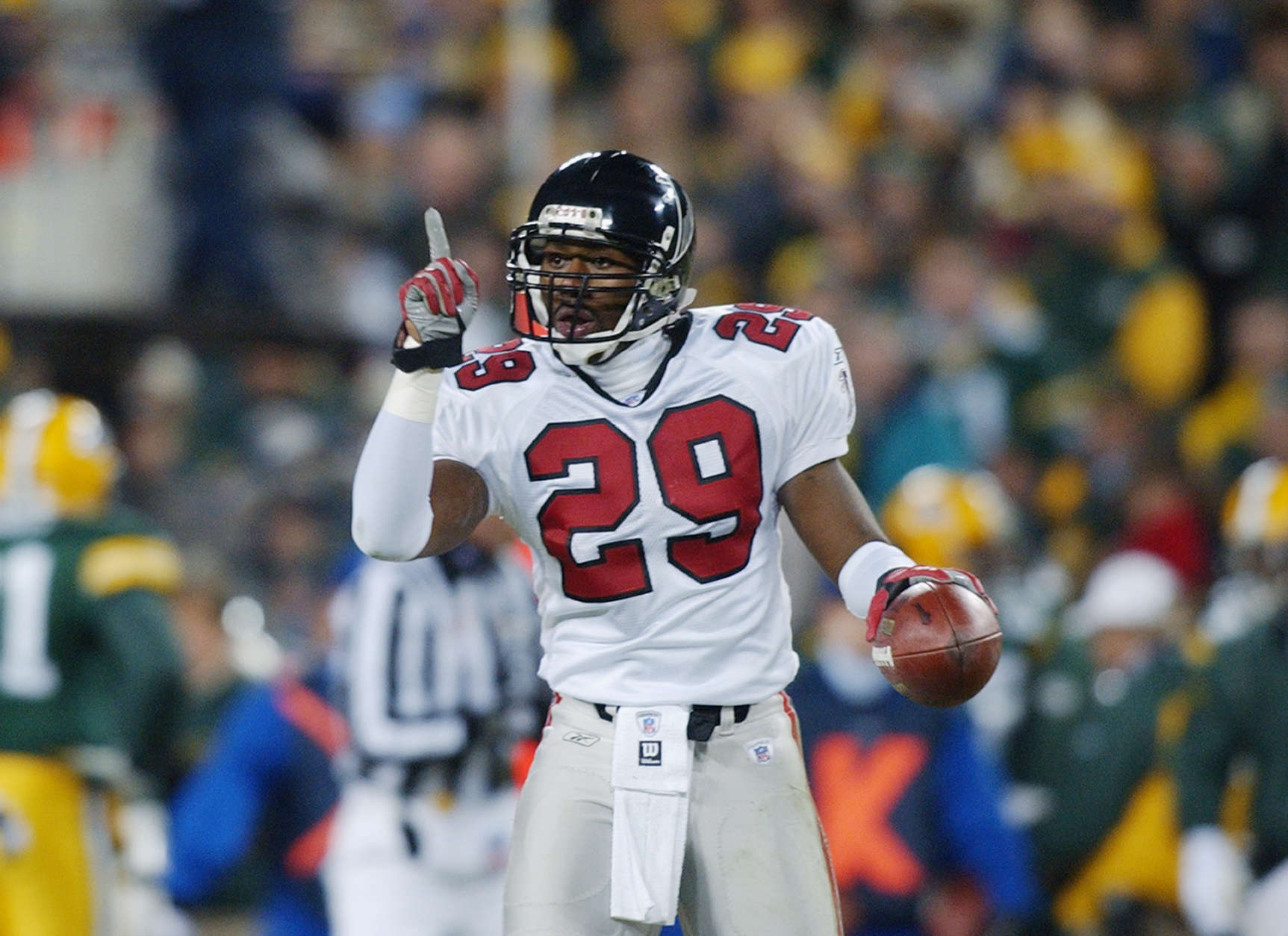 GREEN BAY, WI - JANUARY 4:  Keion Carpenter #29 of the Atlanta Falcons points to the sky as he celebrates after intercepting a pass against the Green Bay Packers at 8:33 of the first quarter of the NFC Wildcard game on January 4, 2002 at Lambeau Field in Green Bay, Wisconsin.  (Photo by Jonathan Daniel/Getty Images)