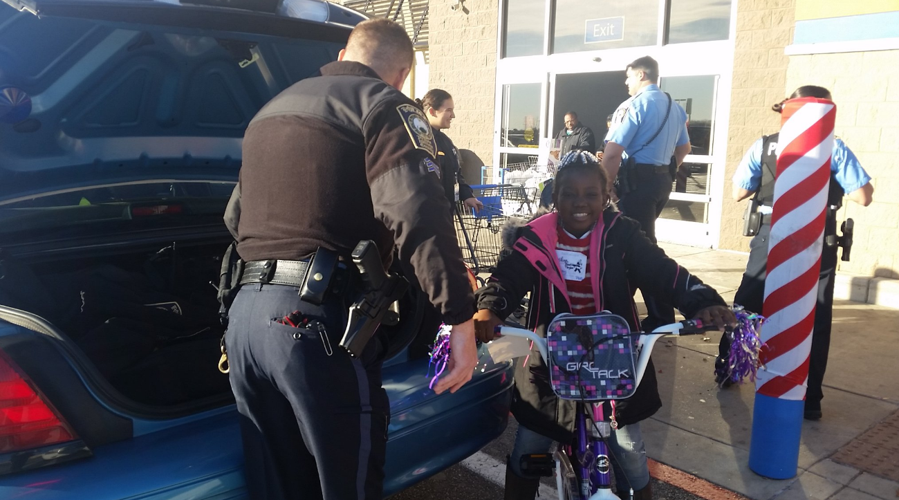 Another successful shopping spree for needy kids in Prince William County with police officers. Smiles, bicycles and even breakfast.(WTOP/Kathy Stewart)