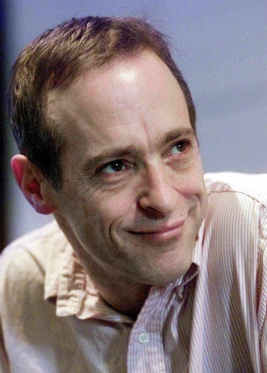** ADVANCE FOR WEEKEND EDITIONS MAY 28-29 **FILE**David Sedaris, author of "Dress Your Family in Corduroy and Denim," pauses during an interview in this March 15, 2001 file photo, at the Greenwich House Theater in New York. (AP Photo/Suzanne Plunkett)