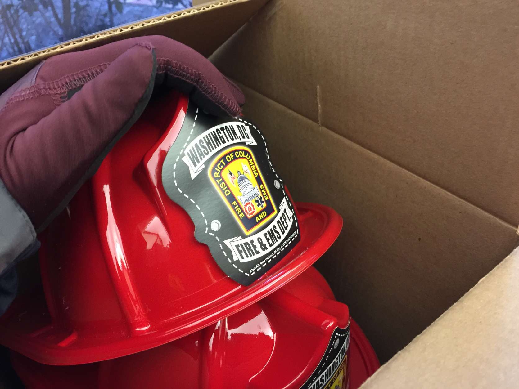Plastic firefighter helmets are given away to kids. "We go to a variety of community events," said D.C. Fire spokesman Vito Maggiolo. "That's one way to attract the children to us, and then we can talk to them about fire safety." (WTOP/Kristi King)