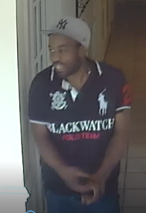 The suspect in a Woodbridge massage parlor attach on Sunday is described as black, mid-20s, around 6 feet tall and weighs about 180 pounds. He has dark hair with a dark-colored, unshaven beard and mustache.  (Courtesy Prince William County Police)
