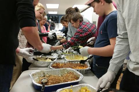 Volunteers hand out meals, gifts to homeless