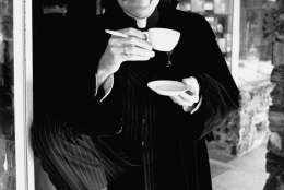 Actor Don Novello poses as Father Guido Sarducci, a character he portrays on "Saturday Night Live," as he smokes a cigarette and drinks a cup of coffee in Los Angeles, Calif., in 1980.  His character is a self-styled Vatican columnist on the weekly television variety show.  (AP Photo/Wally Fong)