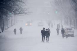 Pedestrians on Wisconsin Avenue in Glover Park on Jan. 23, 2016, during the blizzard that dumped feet of snow on the D.C. area. (WTOP/Dave Dildine)