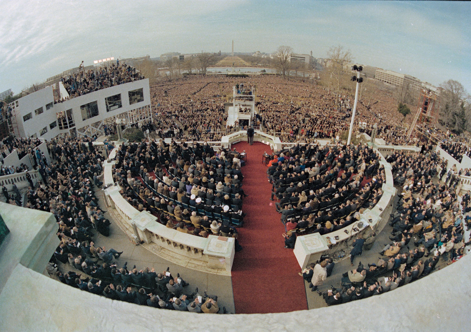 ** FILE ** In this Jan. 20, 1981 file photo, shows a wide angle view from the Capitol balcony as President Ronald Reagan, visible at center, addresses the nation following his swearing-in ceremony in Washington.  President-elect Barack Obama's inauguration is expected to draw 1 million-plus to the capital, and already some lawmakers have stopped taking ticket requests and hotels have booked up.  (AP Photo, File)