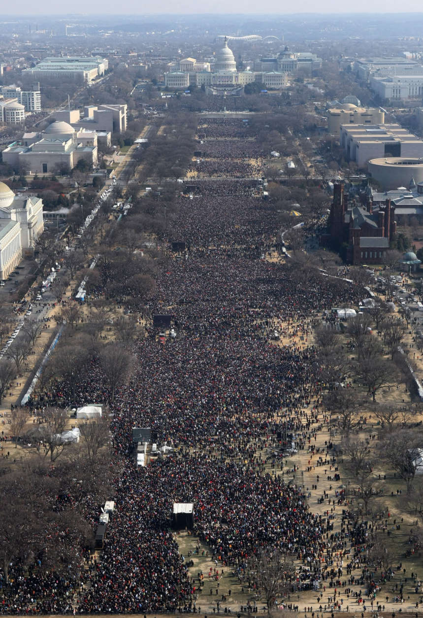 Crowds gather along the National Mall during the swearing-in ceremony of President-elect Barack Obama, Tuesday, Jan, 20, 2009, in Washington. (AP Photo/Luis M. Alvarez)