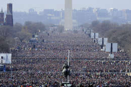 A crowd on the National Mall listen to the inaugural address of President Barack Obama at the U.S. Capitol in Washington, Tuesday, Jan. 20, 2009. (AP Photo/Susan Walsh)