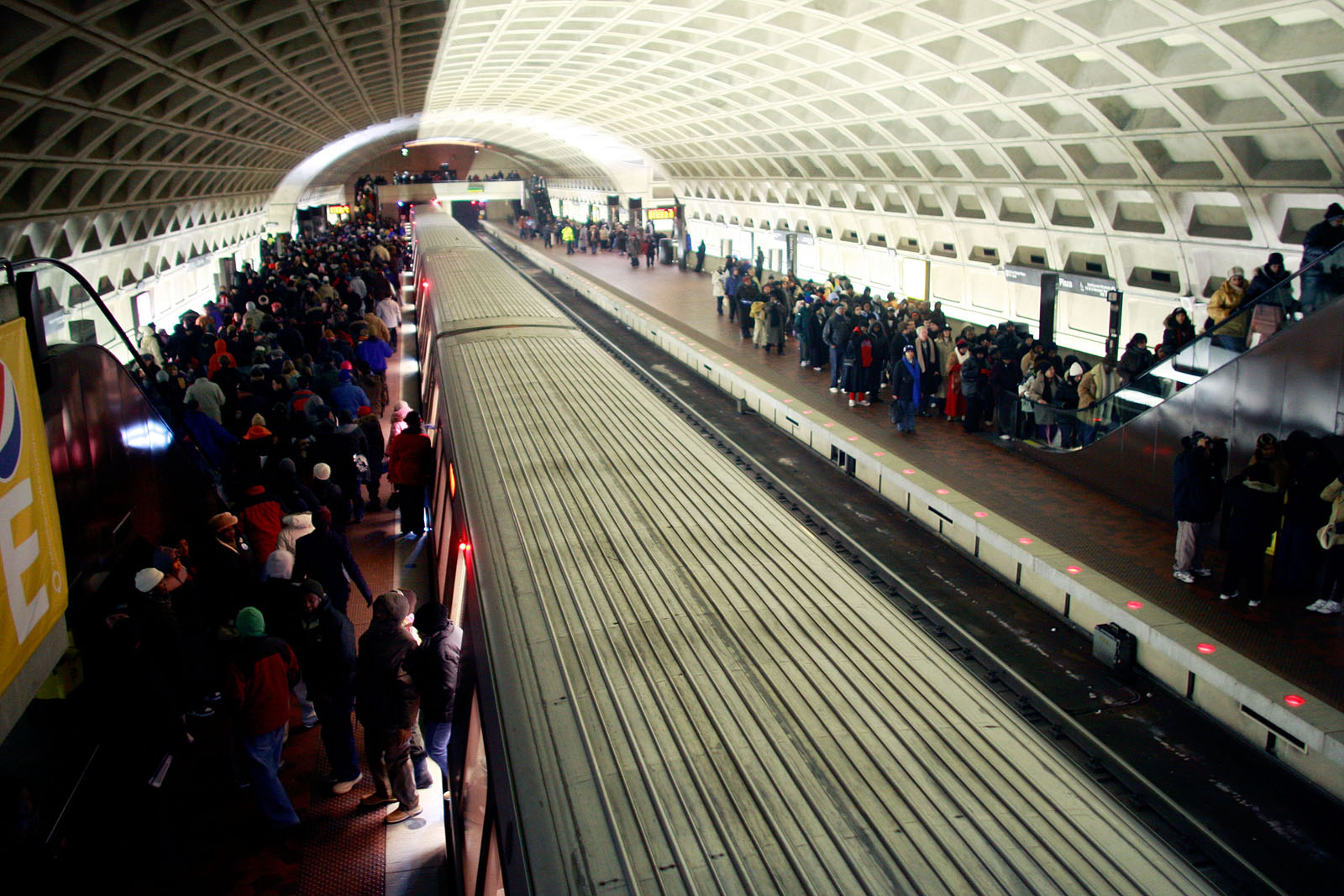 WASHINGTON, D.C. - JANUARY 20:  WASHINGTON, D.C. - JANUARY 20:  People debark the Metro during the inauguration of Barack Obama as the 44th President of the United States of America January 20, 2009 in Washington, DC. Obama becomes the first African-American to be elected to the office of President in the history of the United States.  (Photo by Mario Tama/Getty Images)