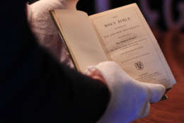 Curator Clark Evans displays the burgundy velvet, gilt-edged Lincoln Inaugural Bible at the Library of Congress Tuesday, Dec. 23, 2008, in Washington. President-elect Barack Obama will take his oath of office on the bible Jan. 20, becoming the first president to use it since Abraham Lincoln at his swearing-in on March 4, 1861. (AP Photo/Lauren Victoria Burke)