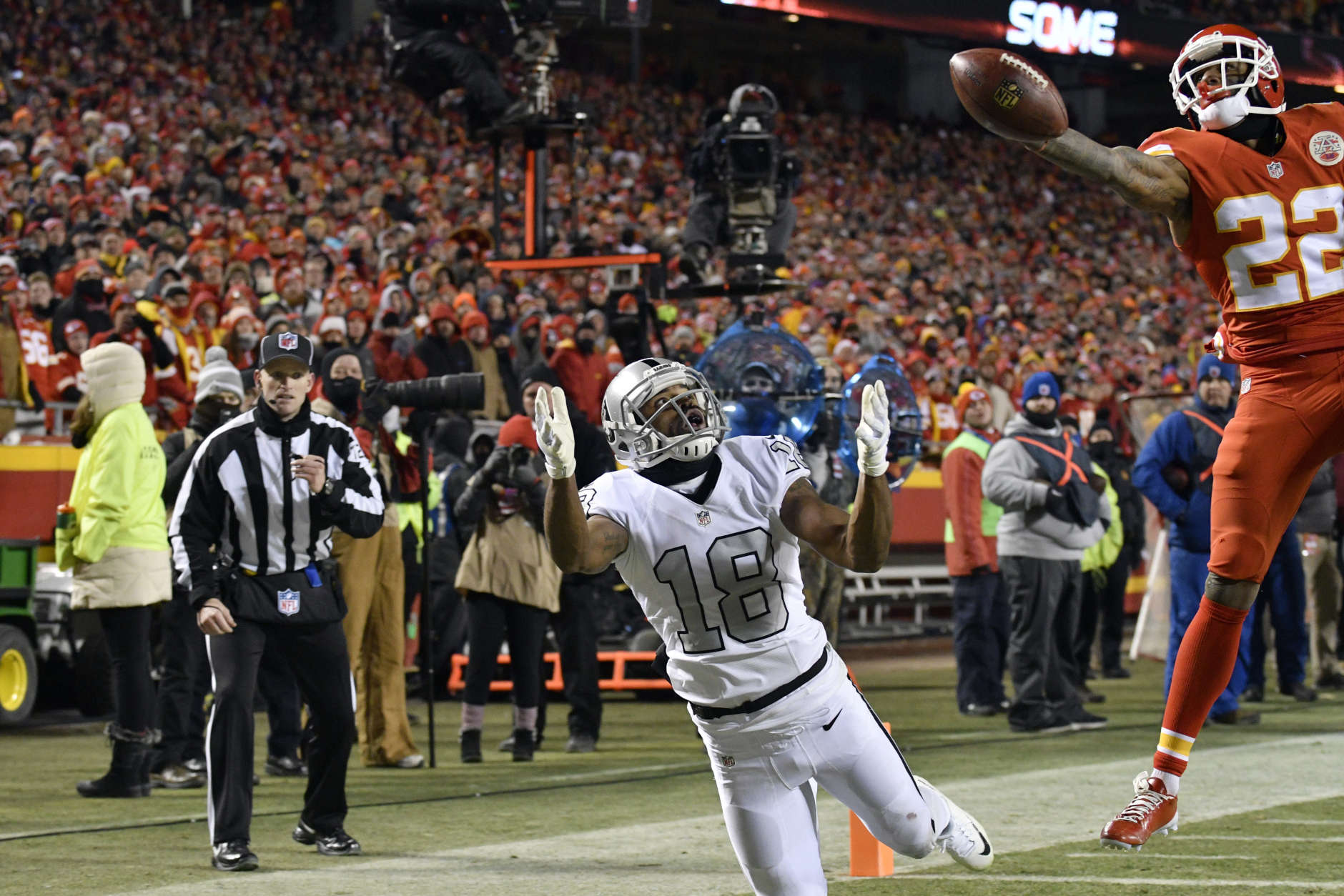 Kansas City Chiefs defensive back Marcus Peters (22) breaks up a pass intended for Oakland Raiders wide receiver Andre Holmes (18) in the end zone, during the second half of an NFL football game in Kansas City, Mo., Thursday, Dec. 8, 2016. (AP Photo/Ed Zurga)