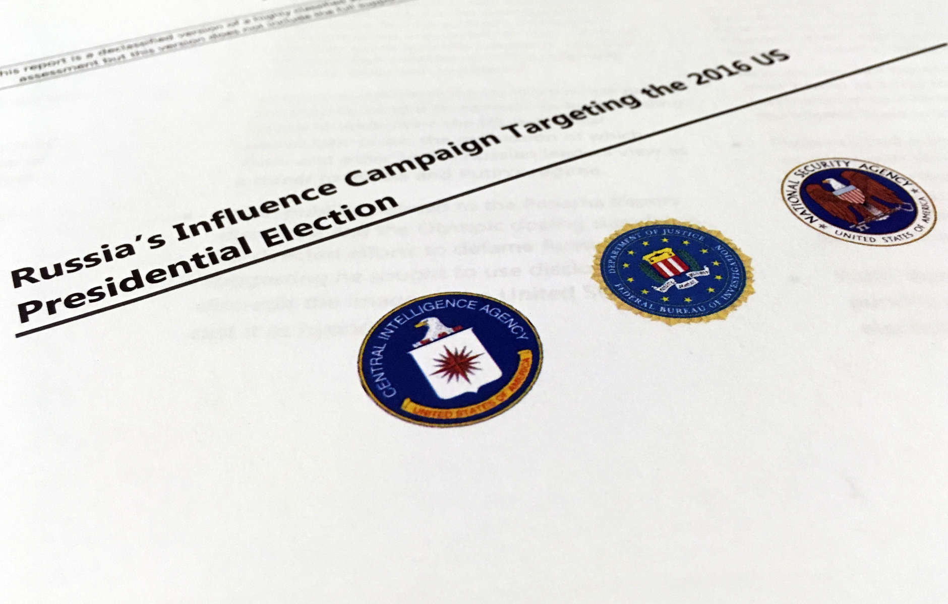 A part of the declassified version Intelligence Community Assessment on Russia's efforts to interfere with the U.S. political process is photographed in Washington, Friday, Jan. 6, 2017. Russian President Vladimir Putin ordered a campaign to influence the American presidential election in favor of electing Donald Trump, according to the report issued by U.S. intelligence agencies. The unclassified version was the most detailed public account to date of Russian efforts to interfere with the U.S. political process, with actions that included hacking into the email accounts of the Democratic National Committee and individual Democrats like Hillary Clinton's campaign chairman John Podesta. (AP Photo/Jon Elswick)