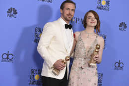 Ryan Gosling, left, and Emma Stone pose in the press room with the award for best performance by an actor and actress in a motion picture - musical or comedy for "La La Land" at the 74th annual Golden Globe Awards at the Beverly Hilton Hotel on Sunday, Jan. 8, 2017, in Beverly Hills, Calif. (Photo by Jordan Strauss/Invision/AP)