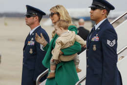 Ivanka Trump carries her son Theodore Kushner, as they arrive at Andrews Air Force Base, Md., Thursday, Jan. 19, 2017, for her father's inauguration. (AP Photo/Evan Vucci)