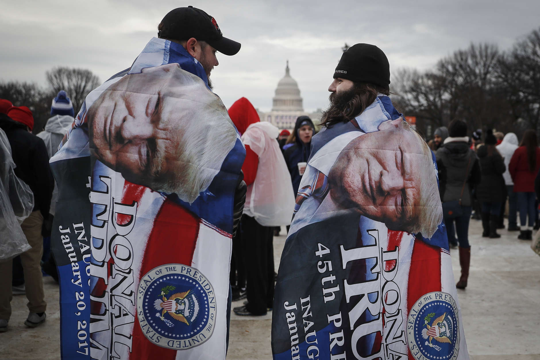 Spectators gather on the National Mall in Washington, Friday, Jan. 20, 2017, before the presidential inauguration of Donald Trump as the 45th president of the United States. (AP Photo/John Minchillo)