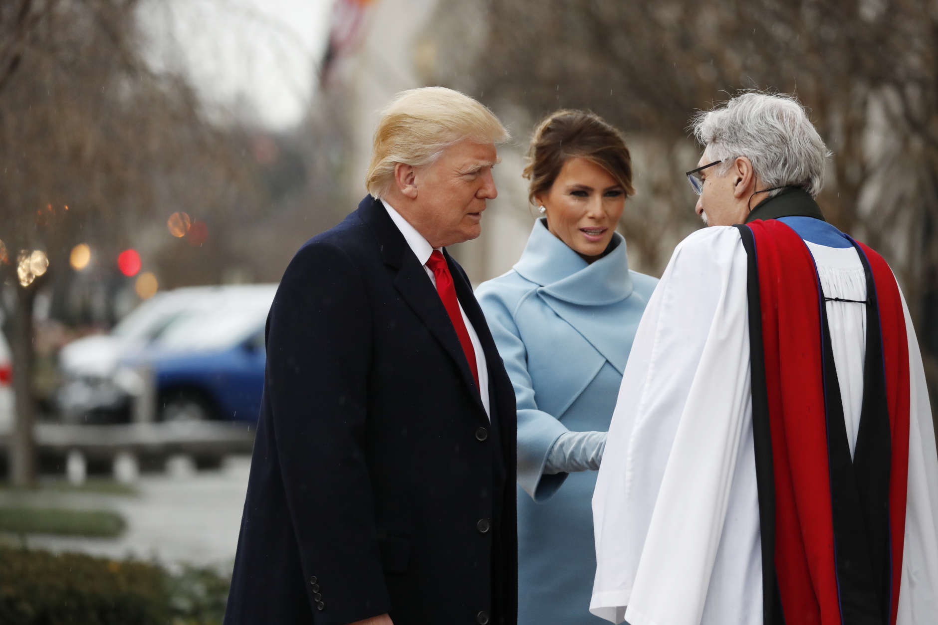Rev. Luis Leon greets President-elect Donald Trump and his wife Melania as they arrive for a church service at St. John’s Episcopal Church across from the White House in Washington, Friday, Jan. 20, 2017, on Donald Trump's inauguration day. (AP Photo/Alex Brandon)