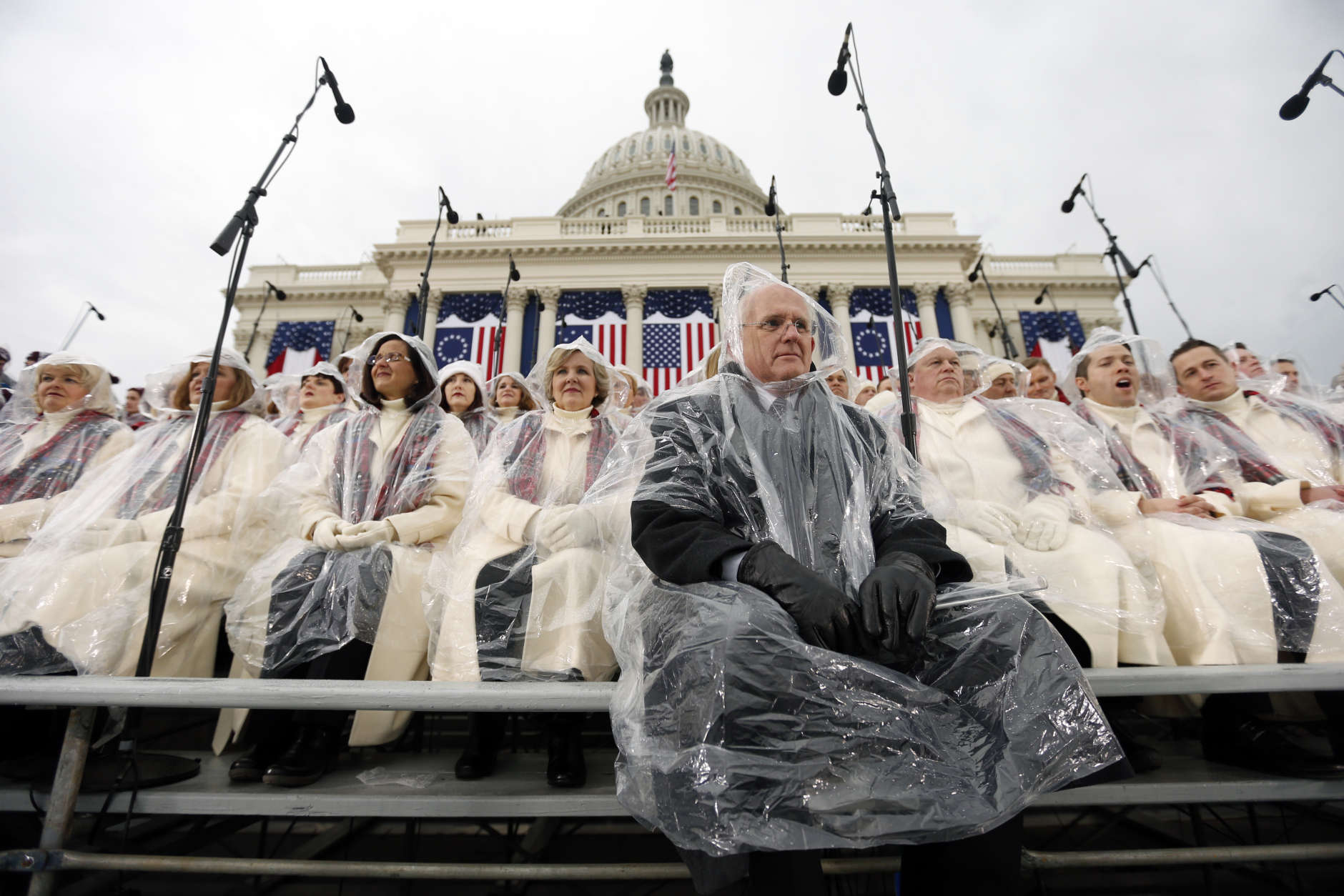 Members of the Mormon Tabernacle Choir sit in the rain waiting for the swearing in of Donald Trump as the 45th president of the United States to begin during the 58th Presidential Inauguration at the U.S. Capitol in Washington. Friday, Jan. 20, 2017 (AP Photo/Carolyn Kaster)