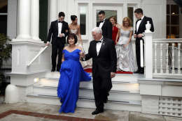 Vice President Mike Pence right, assists his wife Karen Pence as they depart the Naval Observatory for several inaugural balls, Friday, Jan. 20, 2017 in Washington. (AP Photo/Alex Brandon)