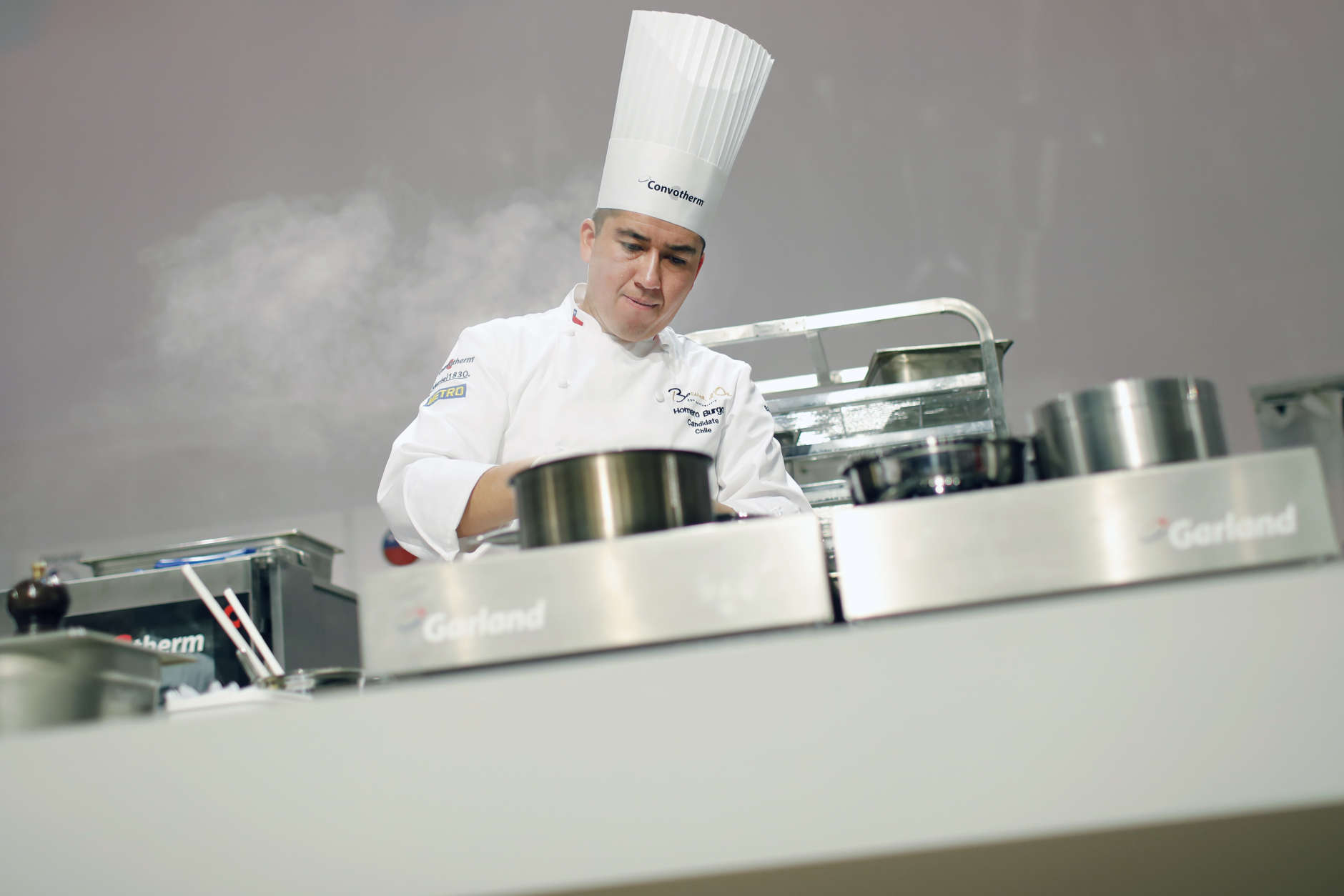 Homero Antonio Burgos Olmos, of Chile, prepares food during the "Bocuse d'Or" (Golden Bocuse) trophy, in Lyon, central France, Tuesday, Jan. 24, 2017. The contest, a sort of world cup of the cuisine, was started in 1987 by Lyon chef Paul Bocuse to reward young international culinary talents. (AP Photo/Laurent Cipriani)