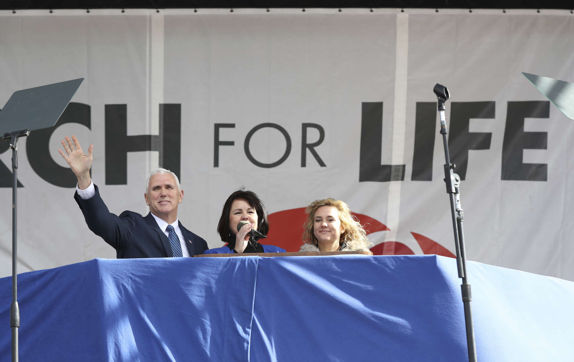 Vice President Mike Pence, left, with his wife Karen Pence, center, wave to the crowd at the March for Life on the National Mall in Washington, Friday, Jan. 27, 2017. (AP Photo/Manuel Balce Ceneta)