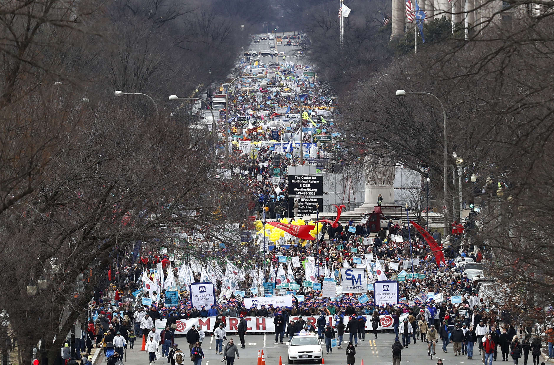 Anti-abortion activists march up Constitution Avenue en route to the Supreme Court in Washington, Friday, Jan. 27, 2017, during the 44th annual March For Life. (AP Photo/Carolyn Kaster)