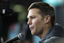 New England Patriots' Tom Brady answers questions during opening night for the NFL Super Bowl 51 football game at Minute Maid Park Monday, Jan. 30, 2017, in Houston. (AP Photo/Charlie Riedel)