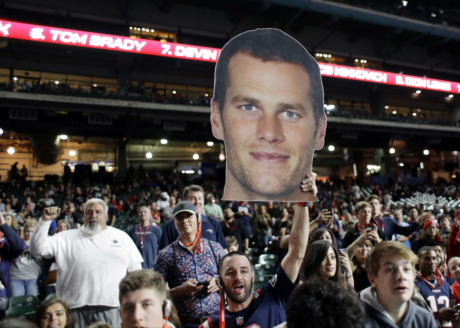 Fans watch the New England Patriots during opening night for the NFL Super Bowl 51 football game at Minute Maid Park Monday, Jan. 30, 2017, in Houston. (AP Photo/Eric Gay)