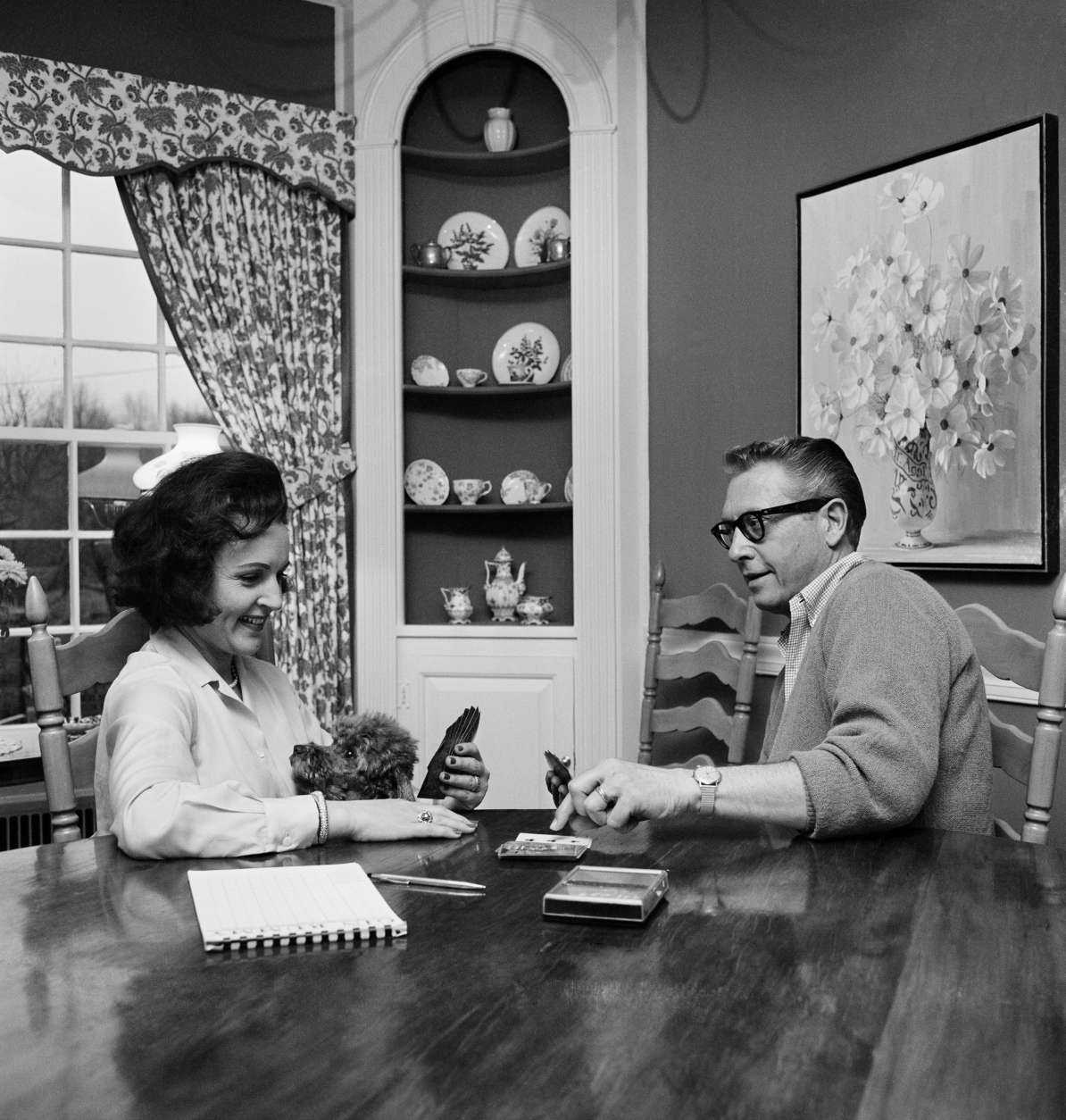 Allen Ludden and his wife Betty White, who love to play games, continue a two year gin rummy battle in which she's ahead by a cumulative 6,000 points in Westchester, N.Y. on April 29, 1965. They do it professionally on TV. He's the master of ceremonies on "Password,"  and she makes frequent guest appearances on game shows. They play games to relax at home. (AP Photo/Bob Wands)