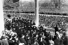 U.S. President Calvin Coolidge, right foreground, delivers his inaugural address after taking the oath of office on the East Portico of the Capitol building in Washington, D.C. on March 4, 1925.  Coolidge was sworn in as the 30th president of the United States.  (AP Photo)