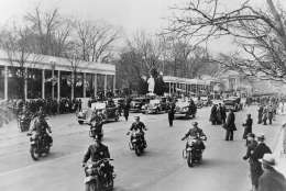 ** FILE ** In this March 4, 1933 file photo, motorcycle police escort the Presidential motorcade from the White House for the Capitol and the inauguration of Franklin D. Roosevelt in Washington.   Behind the cars is the court of honor from which two hours later Roosevelt as President reviewed the inaugural parade. (AP Photo/File)