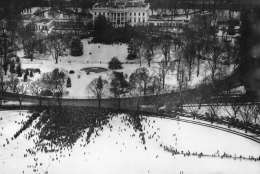 This birdseye view of President Roosevelt's unprecedented fourth term inaugural ceremony was made from the Washington Monument in Washington, D.C., Jan. 20, 1945. The crowd in the foreground is the general public gathered on the ellipse. In the background is the White House, with the crowd of invited guests gathered around the South Portico. (AP Photo)