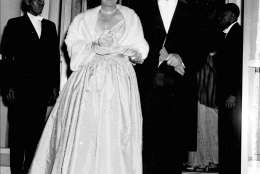 President Dwight Eisenhower holds the arm of his wife, first lady Mamie, as they leave the White House en route to inaugural balls in Washington January 20, 1953. (AP Photo)